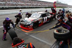 The crew of the No. 11 FedEx Freight Toyota perform a pit stop during Sunday’s Gillette Fusion ProGlide 500 at Pocono Raceway in Long Pond, Penn. Credit: Geoff Burke/Getty Images for NASCAR